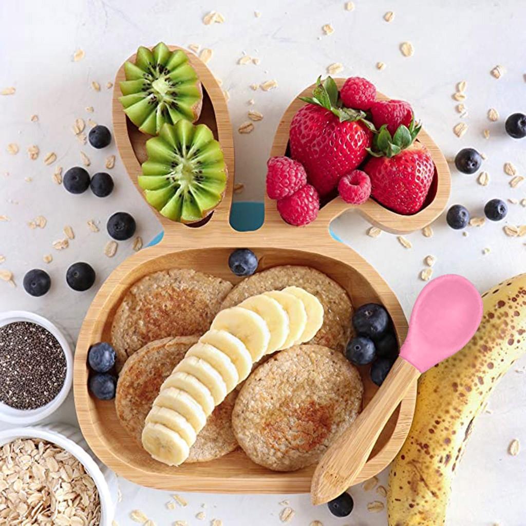 Bamboo baby bowl with suction base and matching spoon. Non-toxic, BPA-free, and eco-friendly, ideal for baby-led weaning and mess-free meals