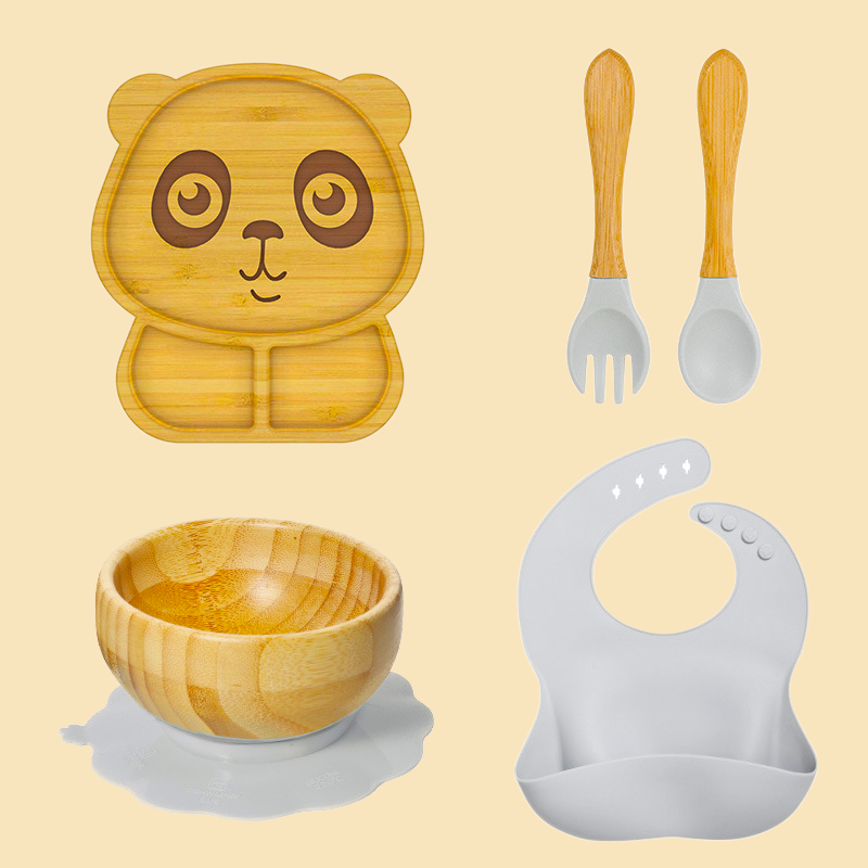 Eco-friendly bamboo suction bowl and waterproof silicone bib set for babies. Non-toxic, BPA-free, and perfect for baby-led weaning and mess-free feeding