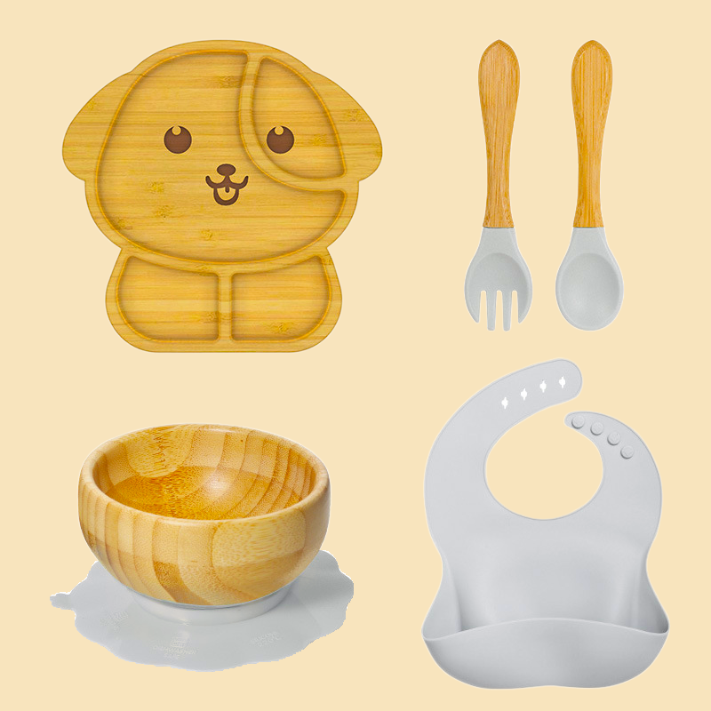 Eco-friendly bamboo suction bowl and waterproof silicone bib set for babies. Non-toxic, BPA-free, and perfect for baby-led weaning and mess-free feeding