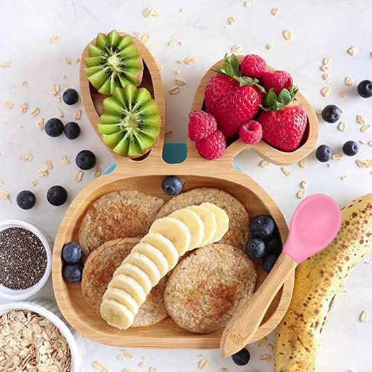 Bamboo baby bowl with suction base and matching spoon. Non-toxic, BPA-free, and eco-friendly, ideal for baby-led weaning and mess-free meals